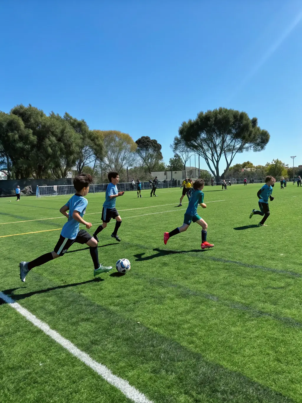 A vibrant image of participants engaged in a soccer match on a sunny field, showcasing teamwork and sportsmanship.